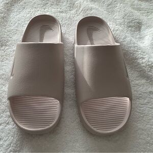 Nike calm pink slides